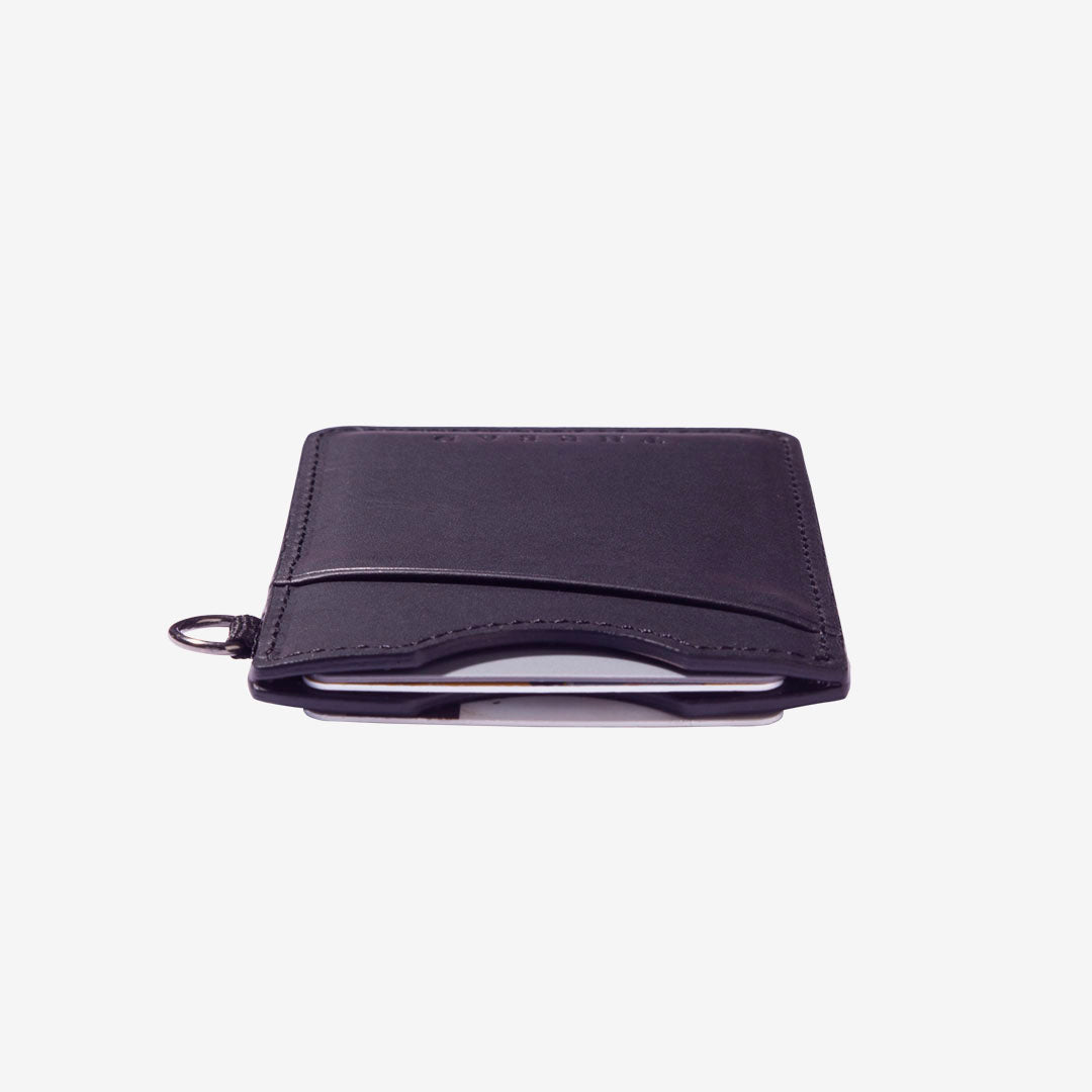Black leather card holder with navy and cream grunge elastic