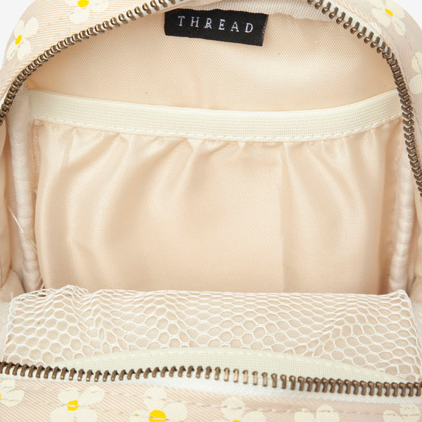 Inside of the Thread® Luna Beige crossbody bag showing pockets and printed lining