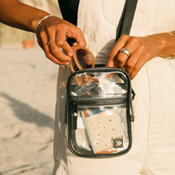 Person wearing the Thread® clear crossbody bag across the chest at an event