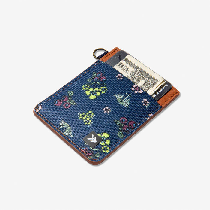 Brown leather vertical wallet with blue floral elastic