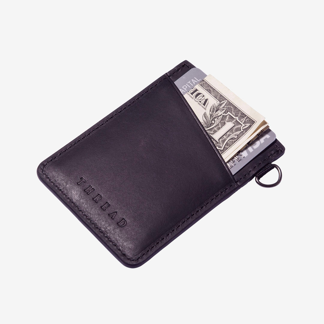 Black leather card holder with navy and cream grunge elastic