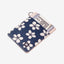 Cream leather card holder with navy and cream floral elastic