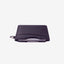 Black leather card holder with navy, olive, and cream striped elastic