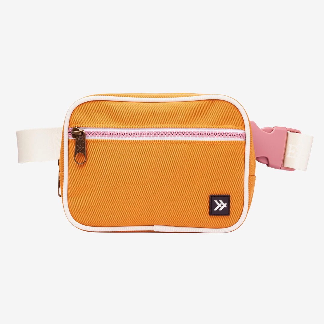 Orange fanny pack with white trims and floral interior