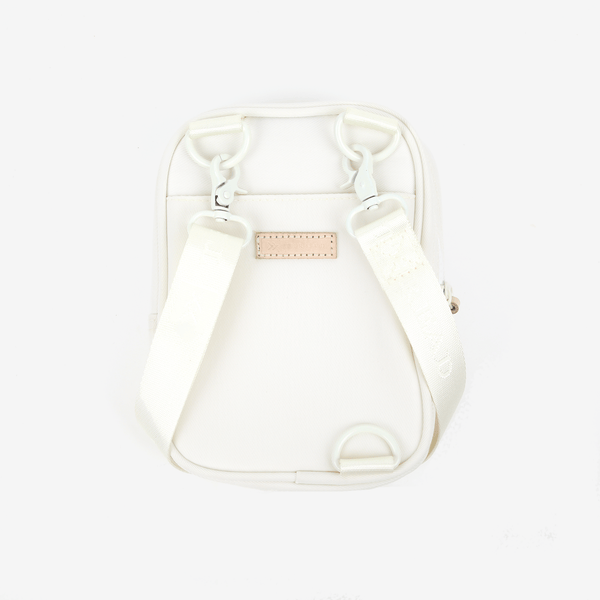 Inside of the Thread® Off White crossbody bag showing pockets and printed lining