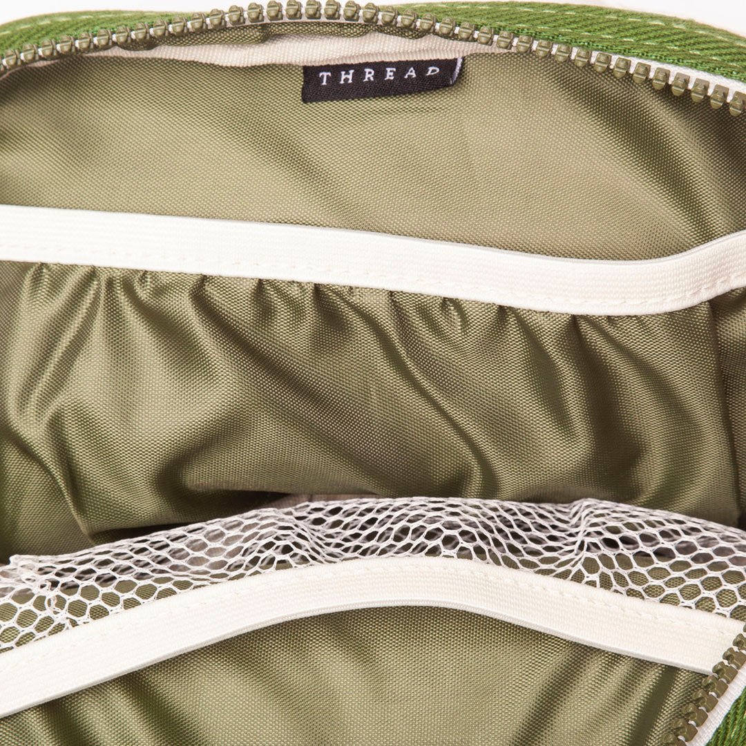Green fanny pack with white trims