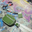Green fanny pack with white trims