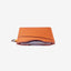 Brown leather card holder with orange and cream striped elastic