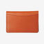 Brown leather bifold wallet with orange and white leopard print elastic
