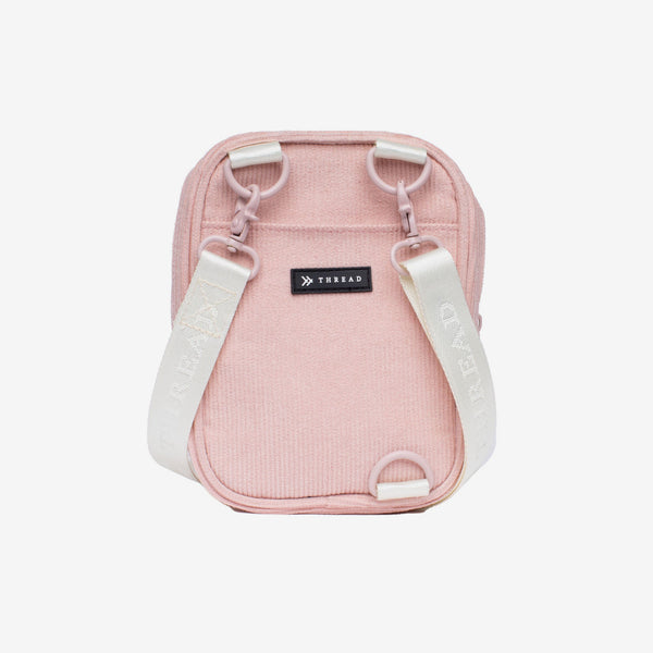 Back of the Thread® Rose Dust Corduroy crossbody bag with white straps and pink clips