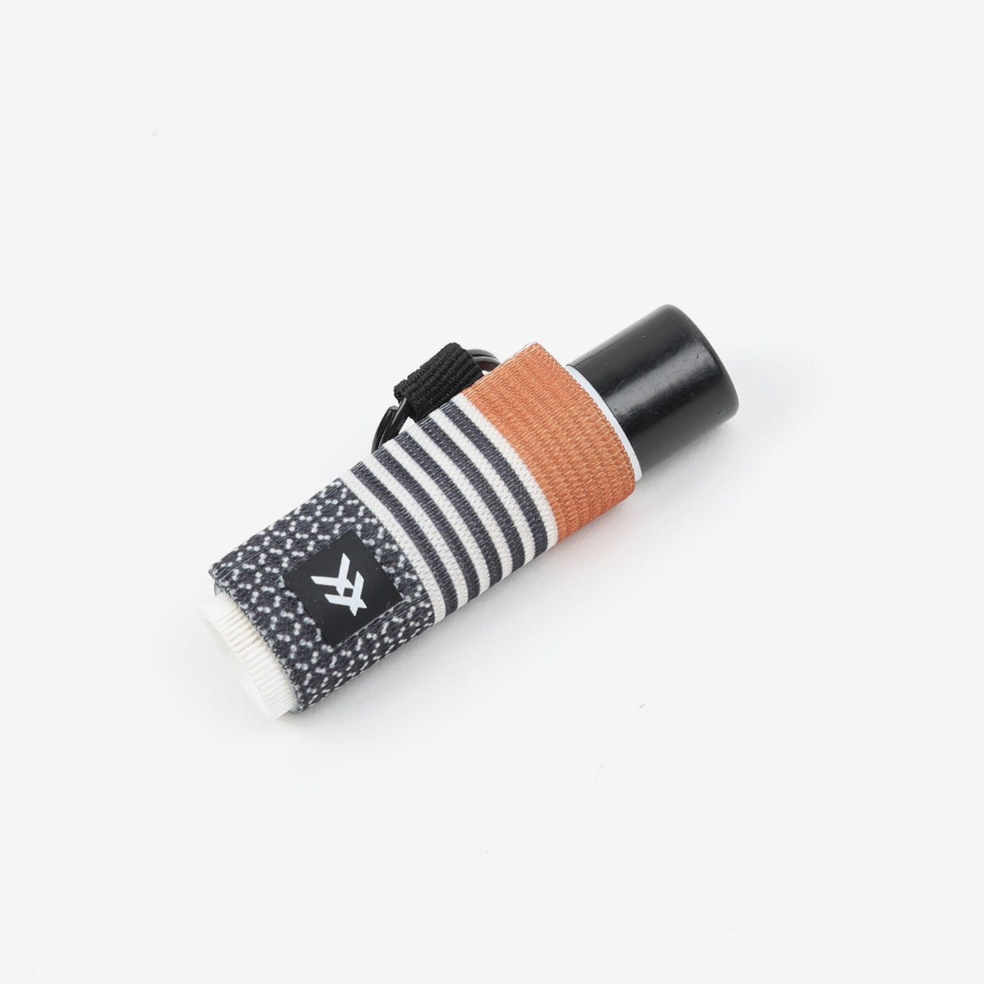 Black, white, and brown striped lip balm holder