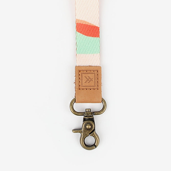 Cream, red, and blue striped neck lanyard